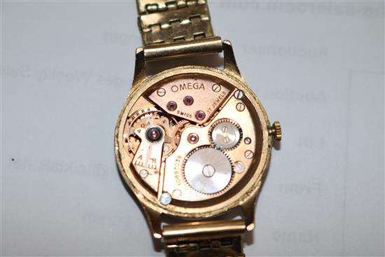 A gentlemans 1940s 9ct gold Omega wrist manual wind watch, with black Arabic dial on rolled gold bracelet.